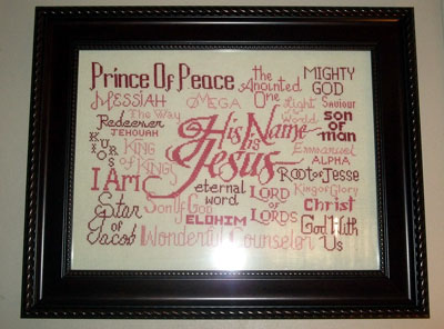 His Name is Jesus stitched by Mary Acosta in berry tones